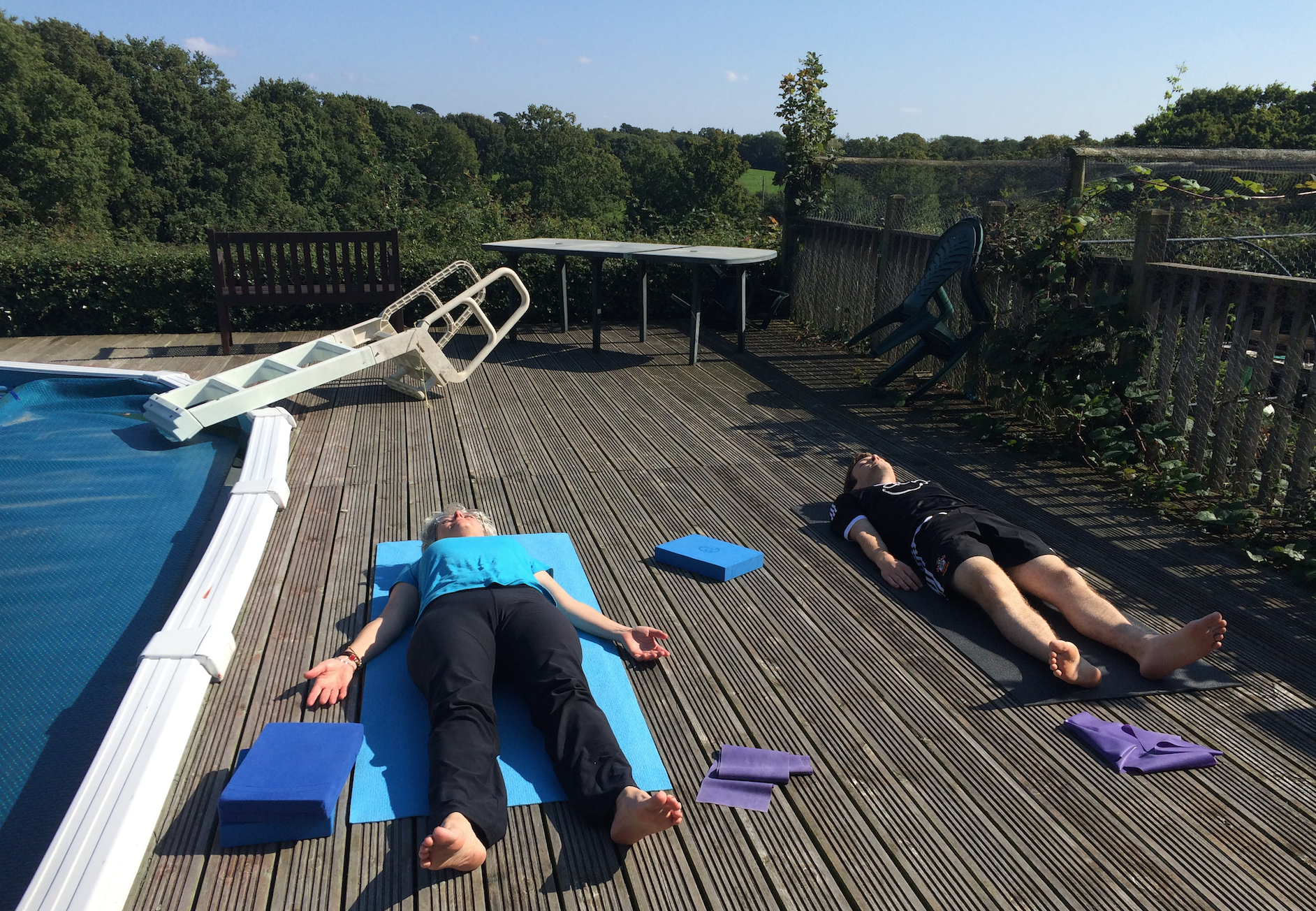 Family yoga session in the sunshine